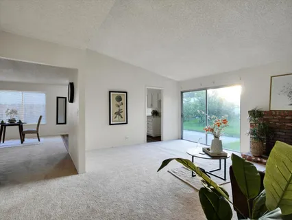 a living room with furniture gym equipment and a fireplace