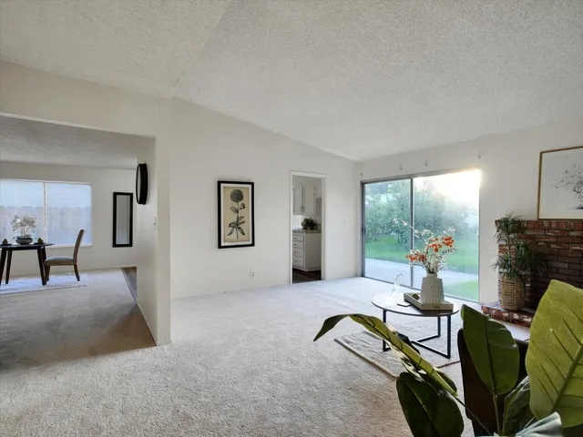 a living room with furniture gym equipment and a fireplace