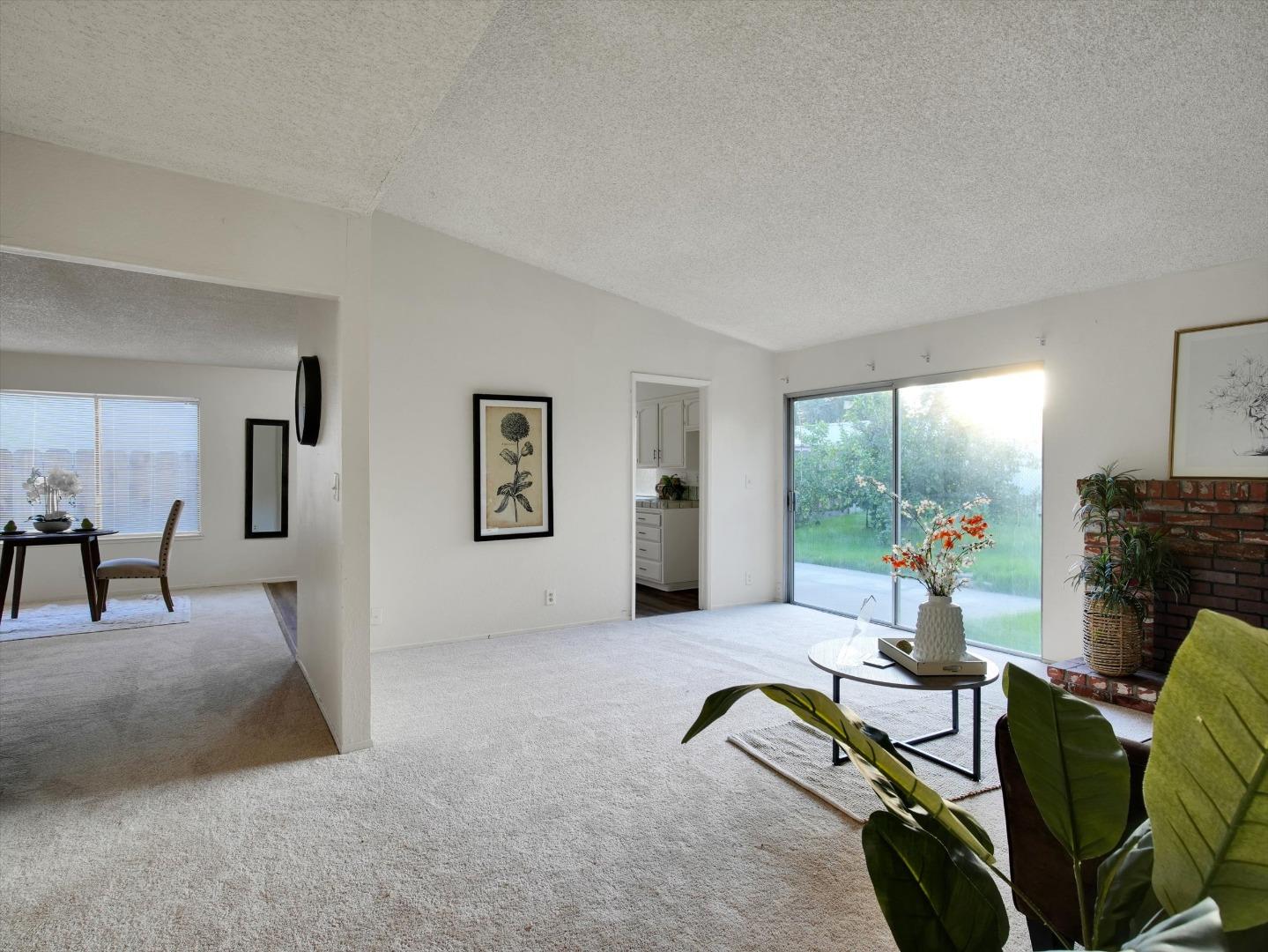 3559 Vernal Avenue Merced, CA 95340 - Photo 4 of 25 a living room with furniture gym equipment and a fireplace