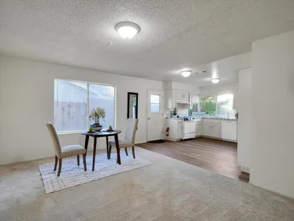 a view of a room with furniture and a livingroom
