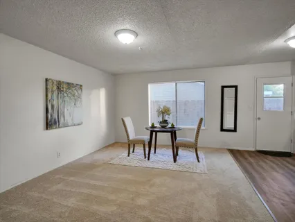 a workspace room with furniture and a window