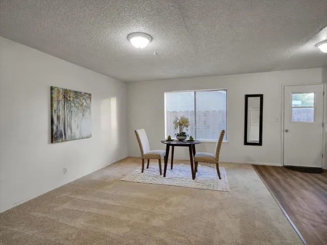 a workspace room with furniture and a window