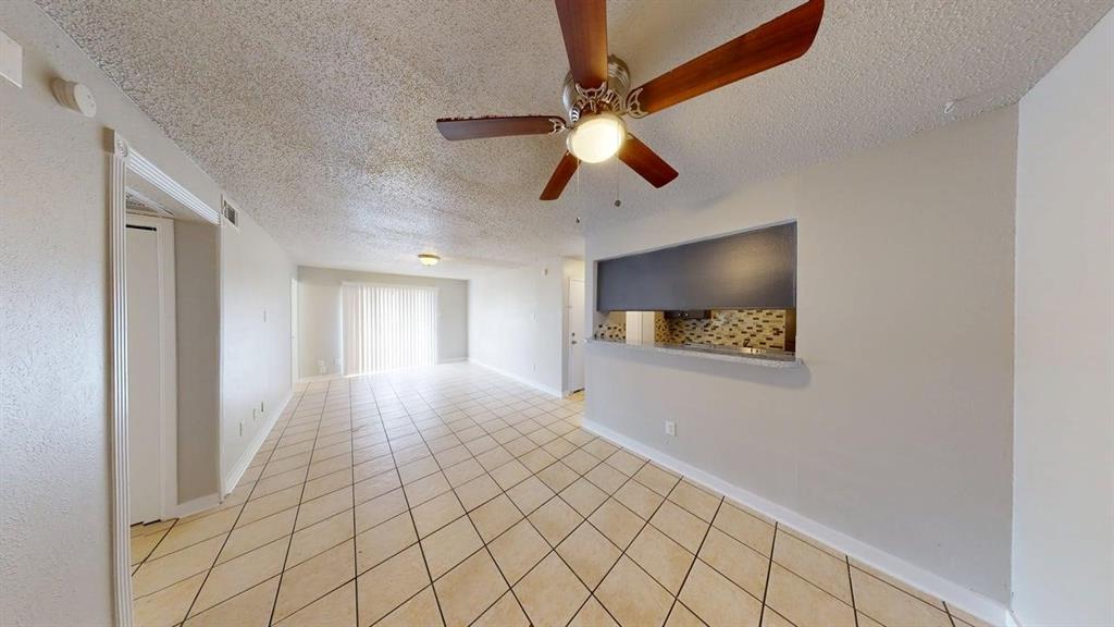 8110 Skillman Street, Unit 1046 Dallas, TX 75231 - Photo 3 of 10 a view of an empty room and window