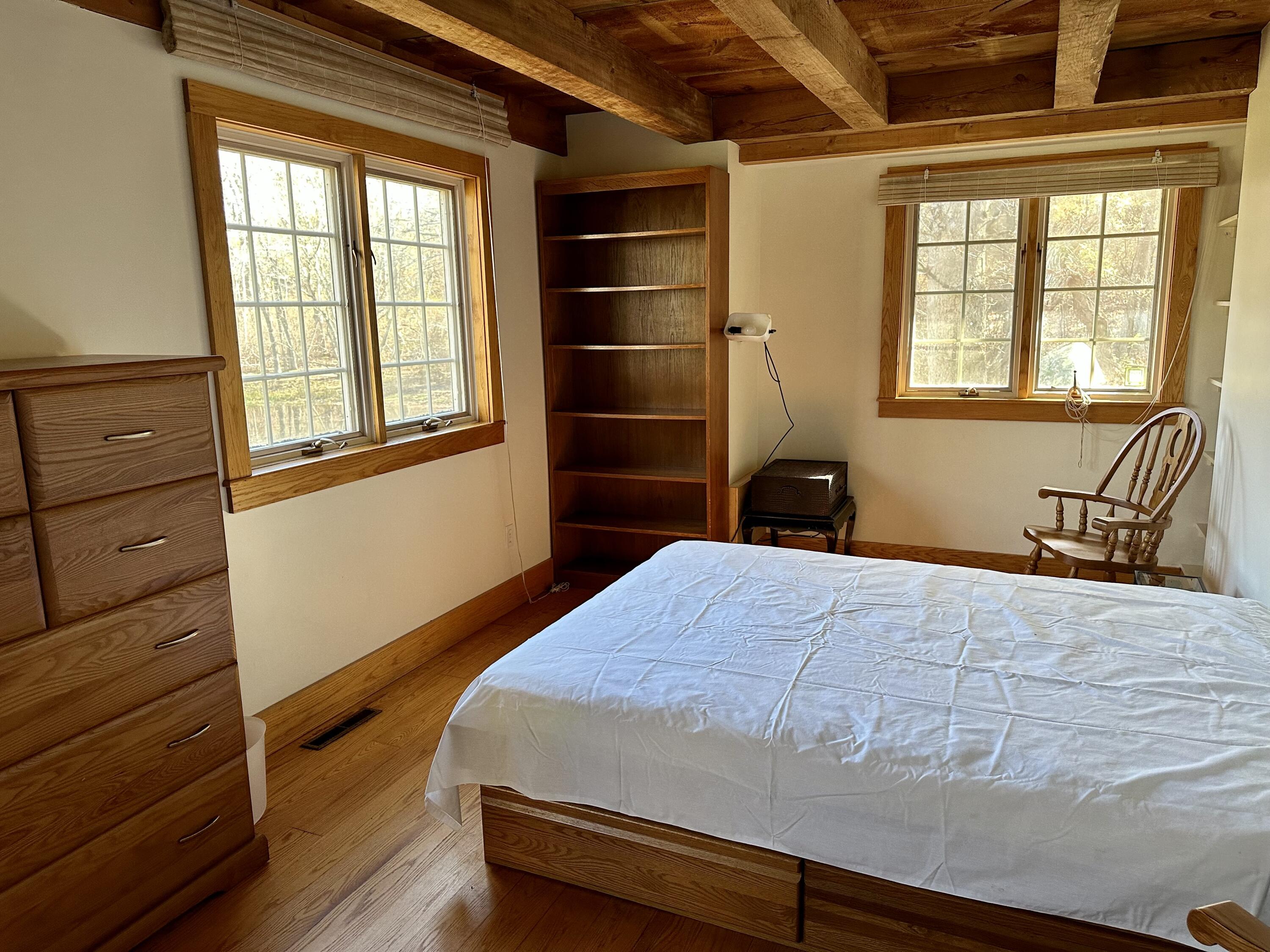 8 Harpoon Hollow Road Aquinnah, MA 02535 - Photo 13 of 29 a bedroom with a bed and a window