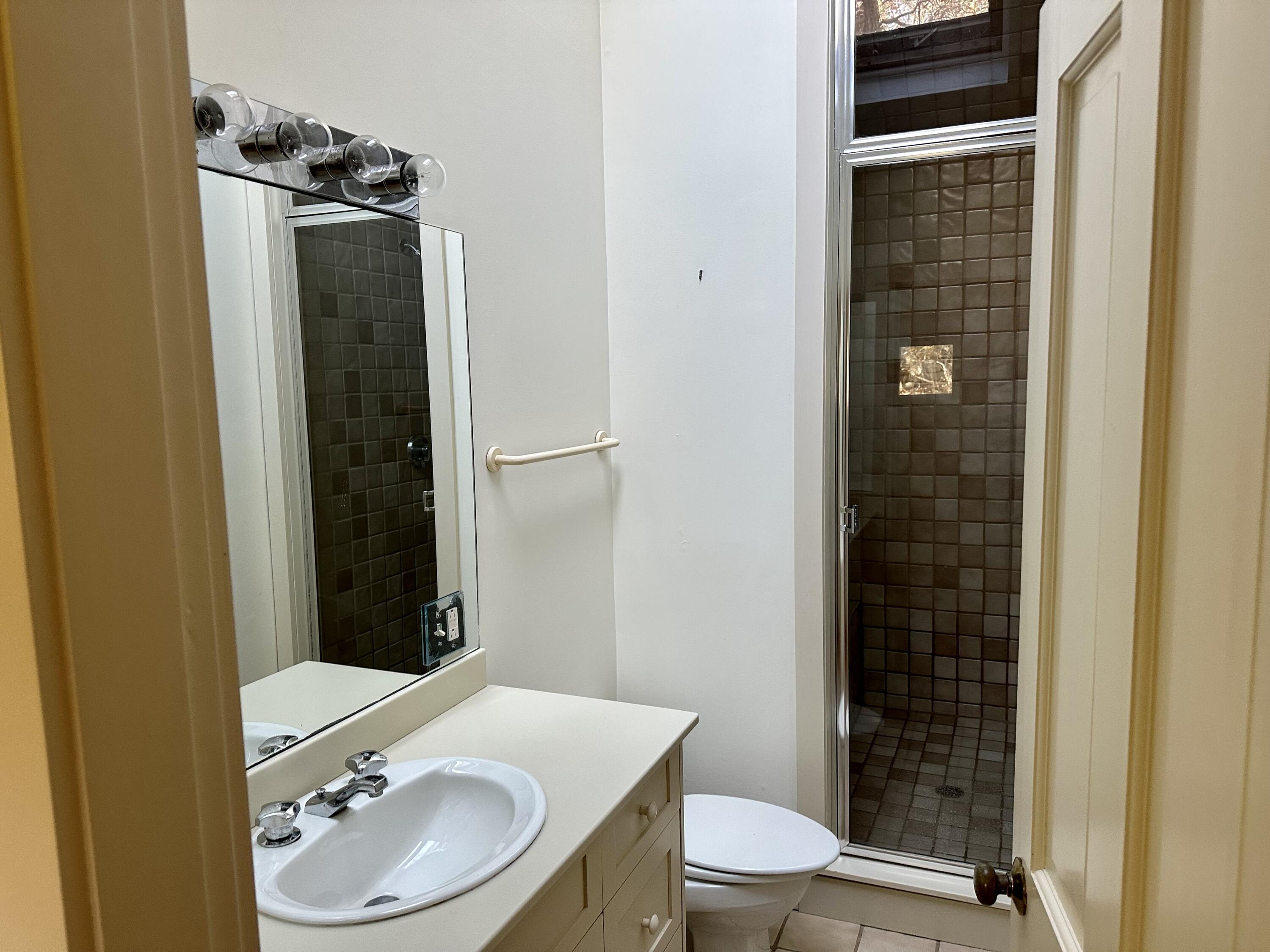 8 Harpoon Hollow Road Aquinnah, MA 02535 - Photo 16 of 29 a bathroom with a sink a toilet and shower