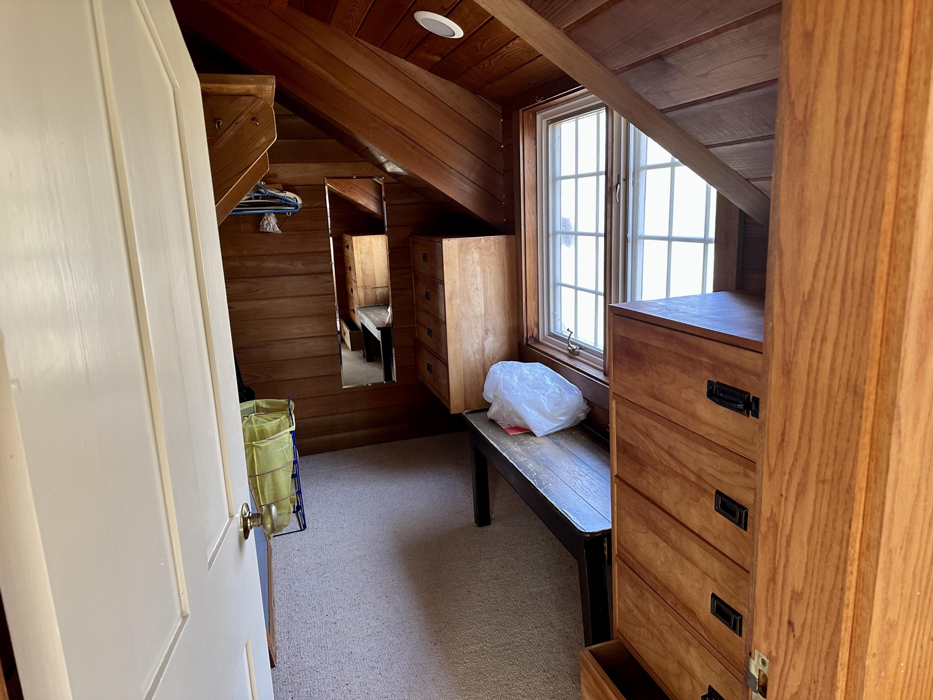 8 Harpoon Hollow Road Aquinnah, MA 02535 - Photo 20 of 29 a view of walk in closet with clothes and shoes