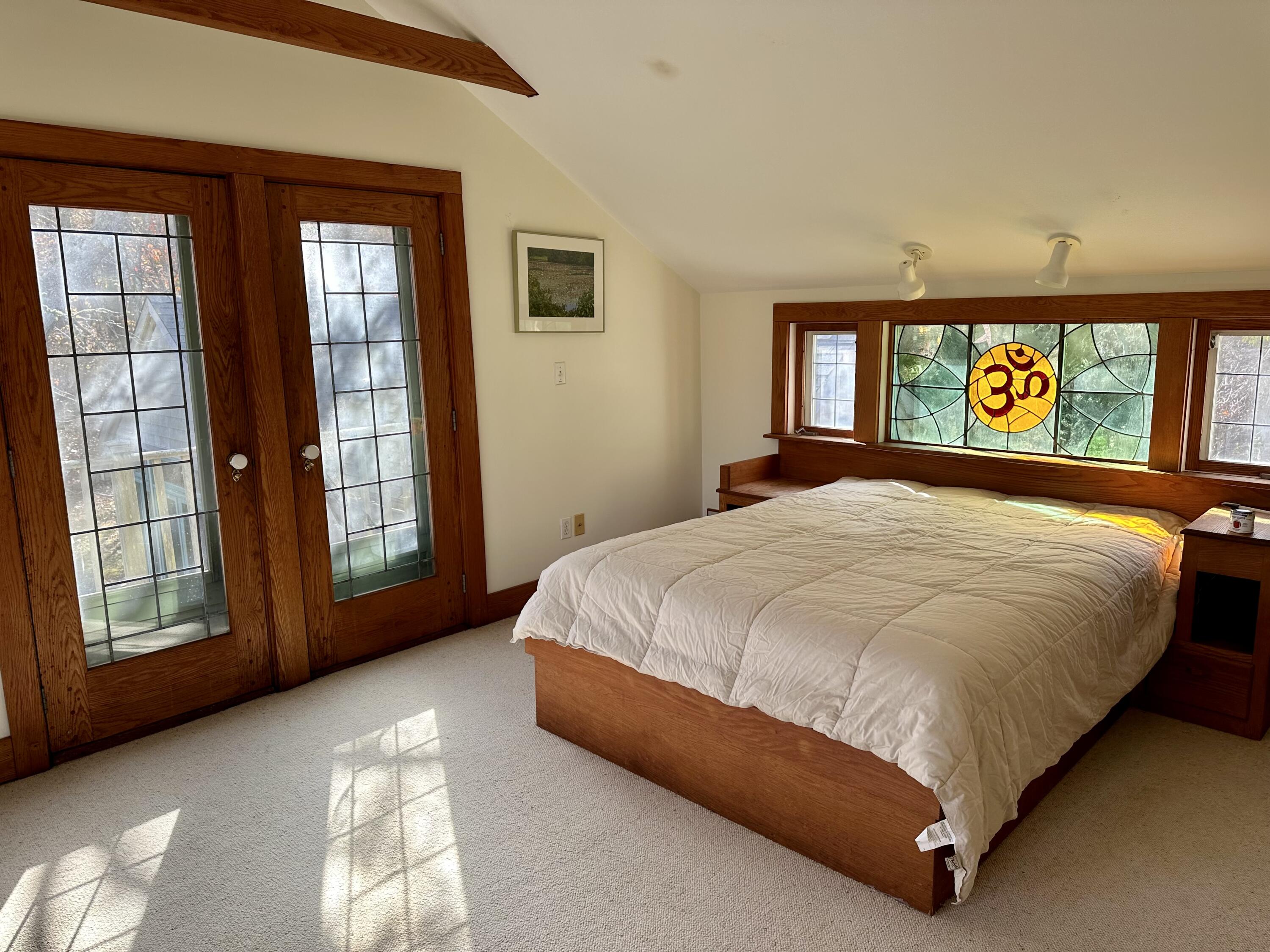 8 Harpoon Hollow Road Aquinnah, MA 02535 - Photo 21 of 29 a bed sitting in a bedroom next to a window