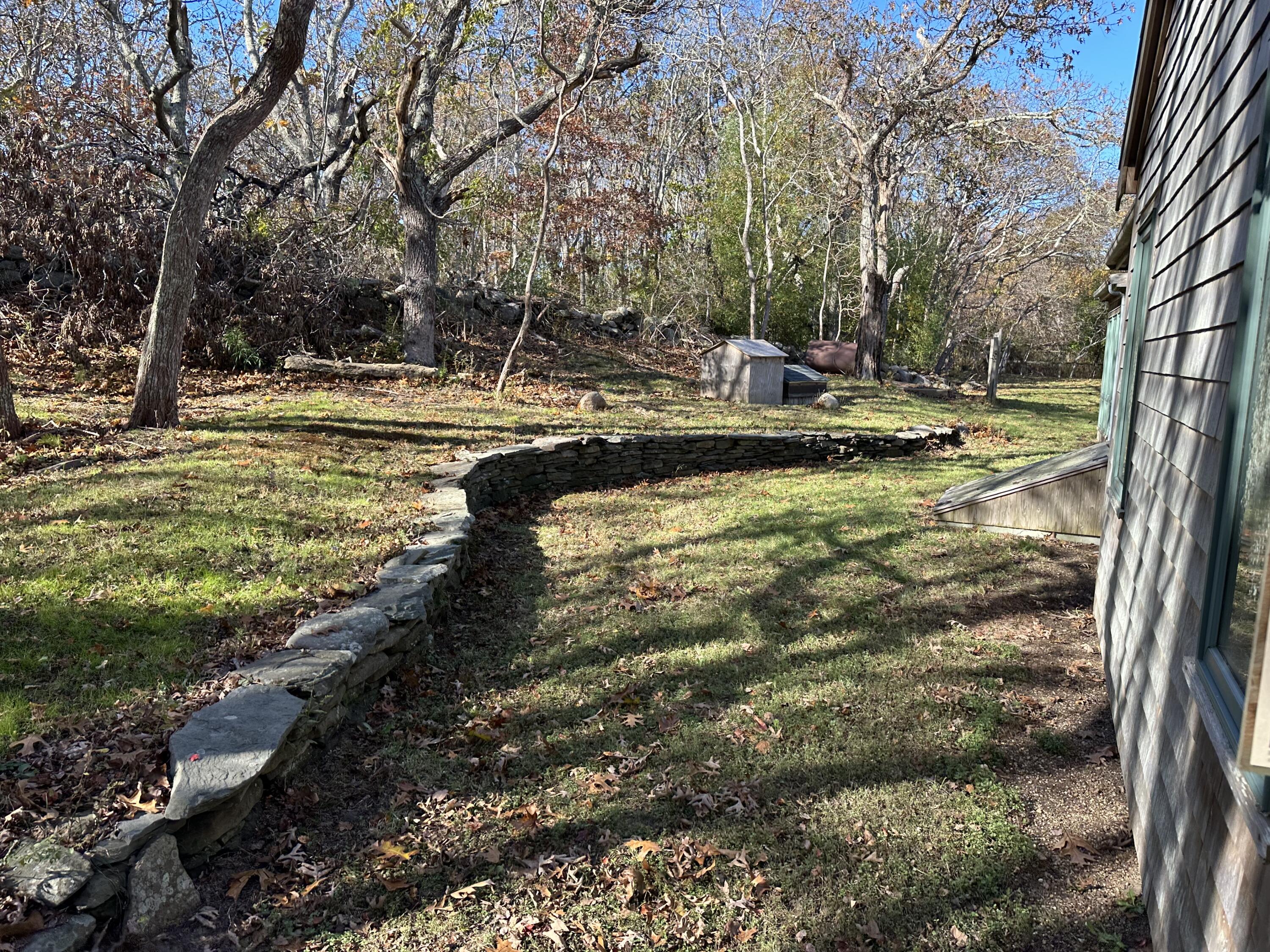 8 Harpoon Hollow Road Aquinnah, MA 02535 - Photo 23 of 29 a view of a swimming pool with an outdoor space