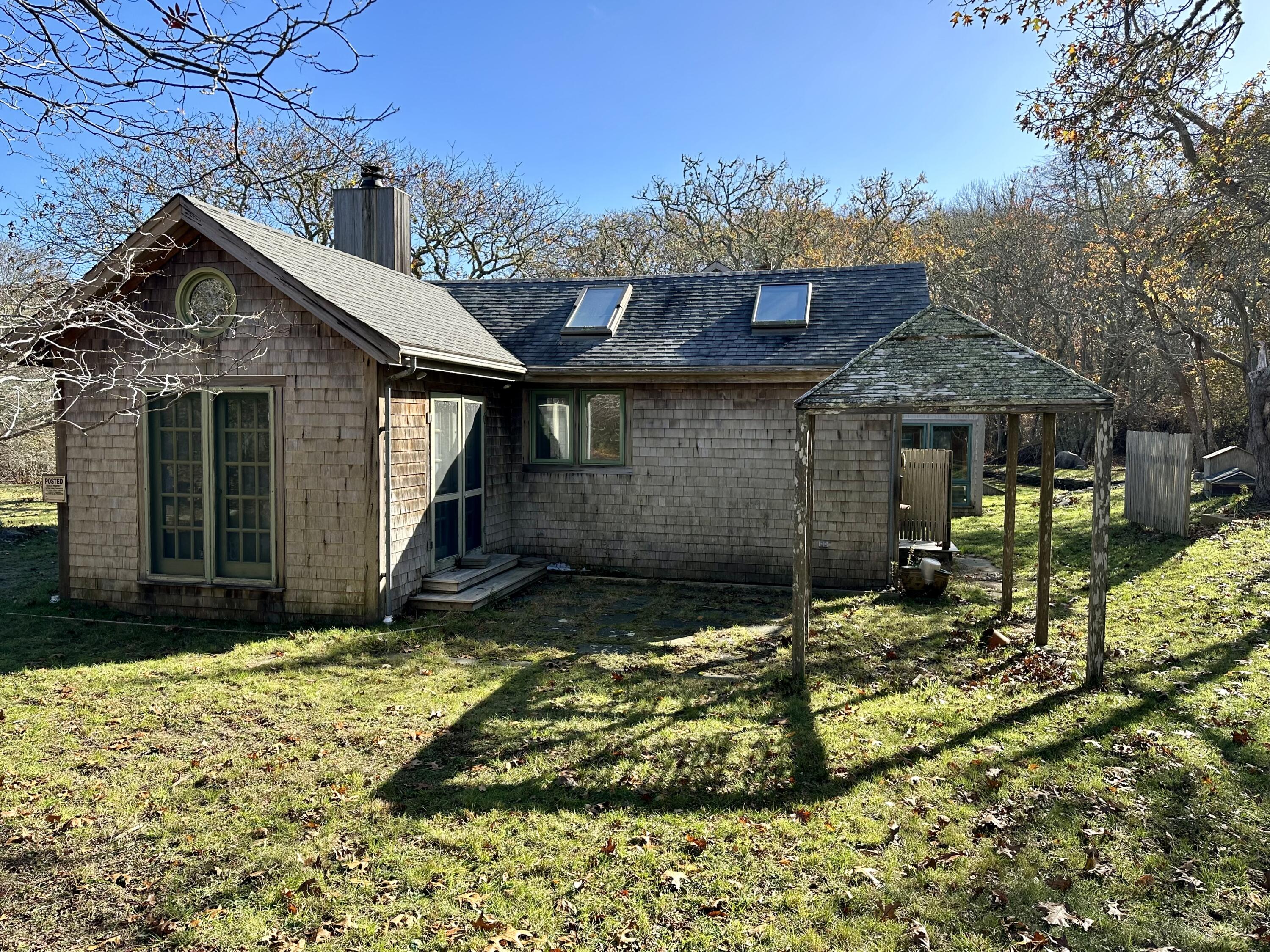 8 Harpoon Hollow Road Aquinnah, MA 02535 - Photo 24 of 29 a view of a house with backyard