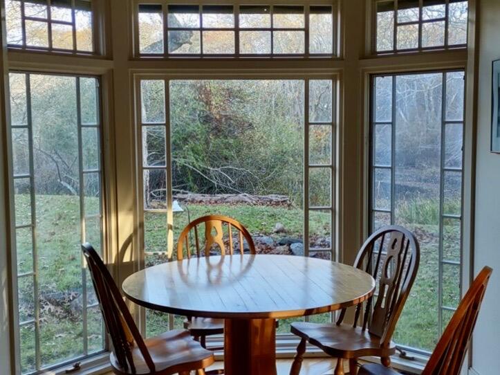 8 Harpoon Hollow Road Aquinnah, MA 02535 - Photo 3 of 29 a view of a dining room with furniture window and wooden floor