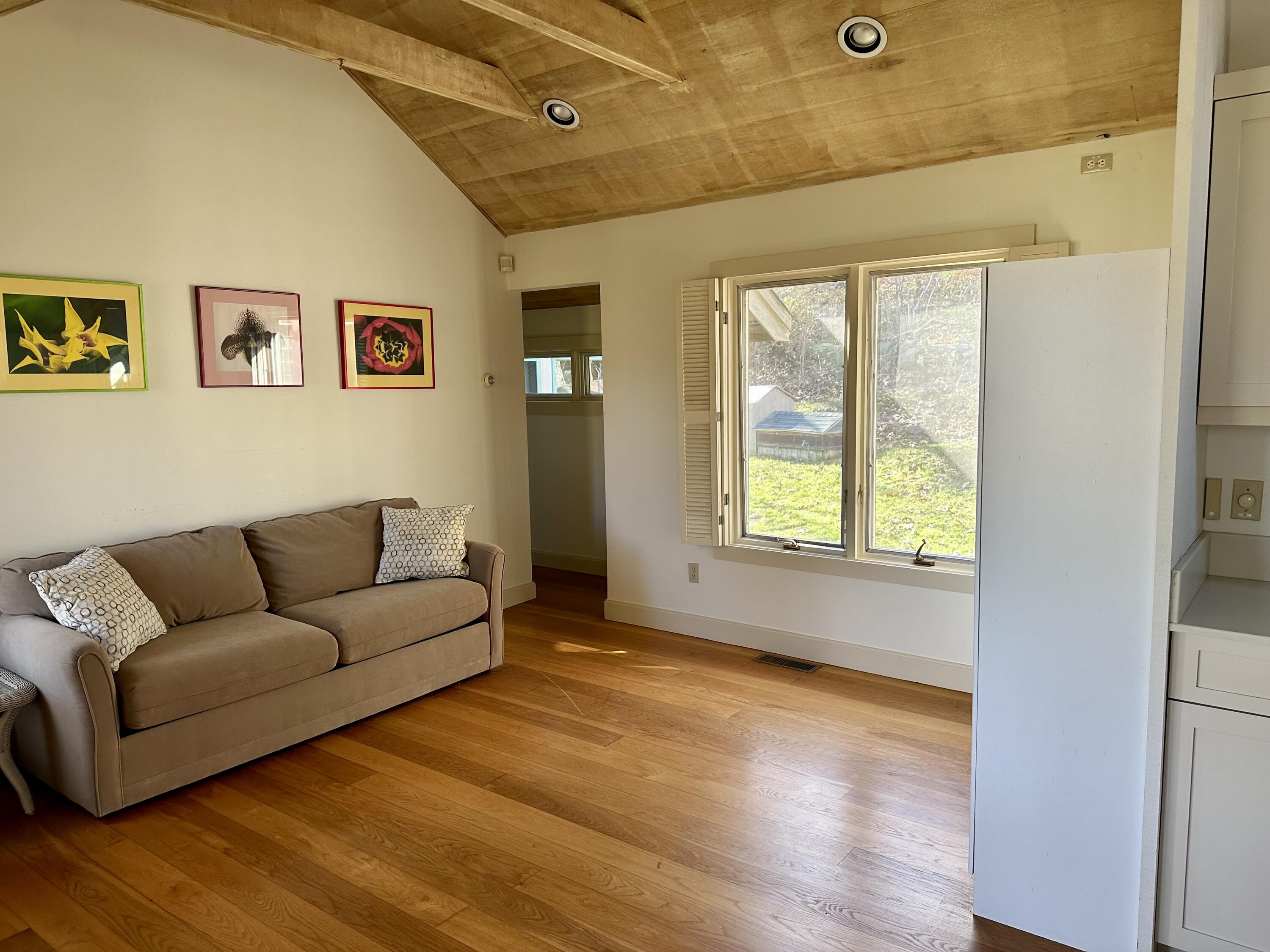 8 Harpoon Hollow Road Aquinnah, MA 02535 - Photo 5 of 29 a living room with furniture and a large window