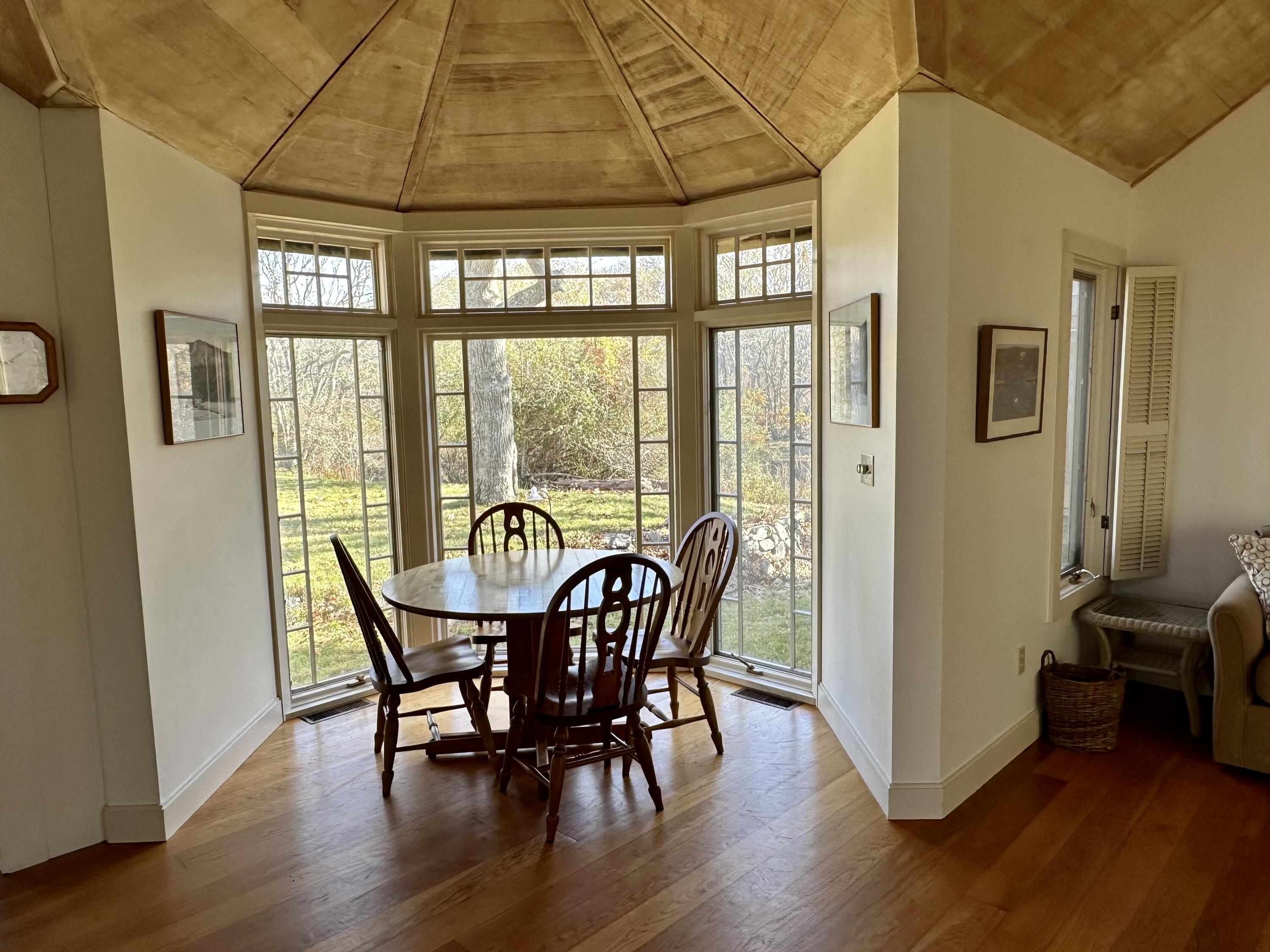 8 Harpoon Hollow Road Aquinnah, MA 02535 - Photo 6 of 29 a view of a dining room with furniture and wooden floor