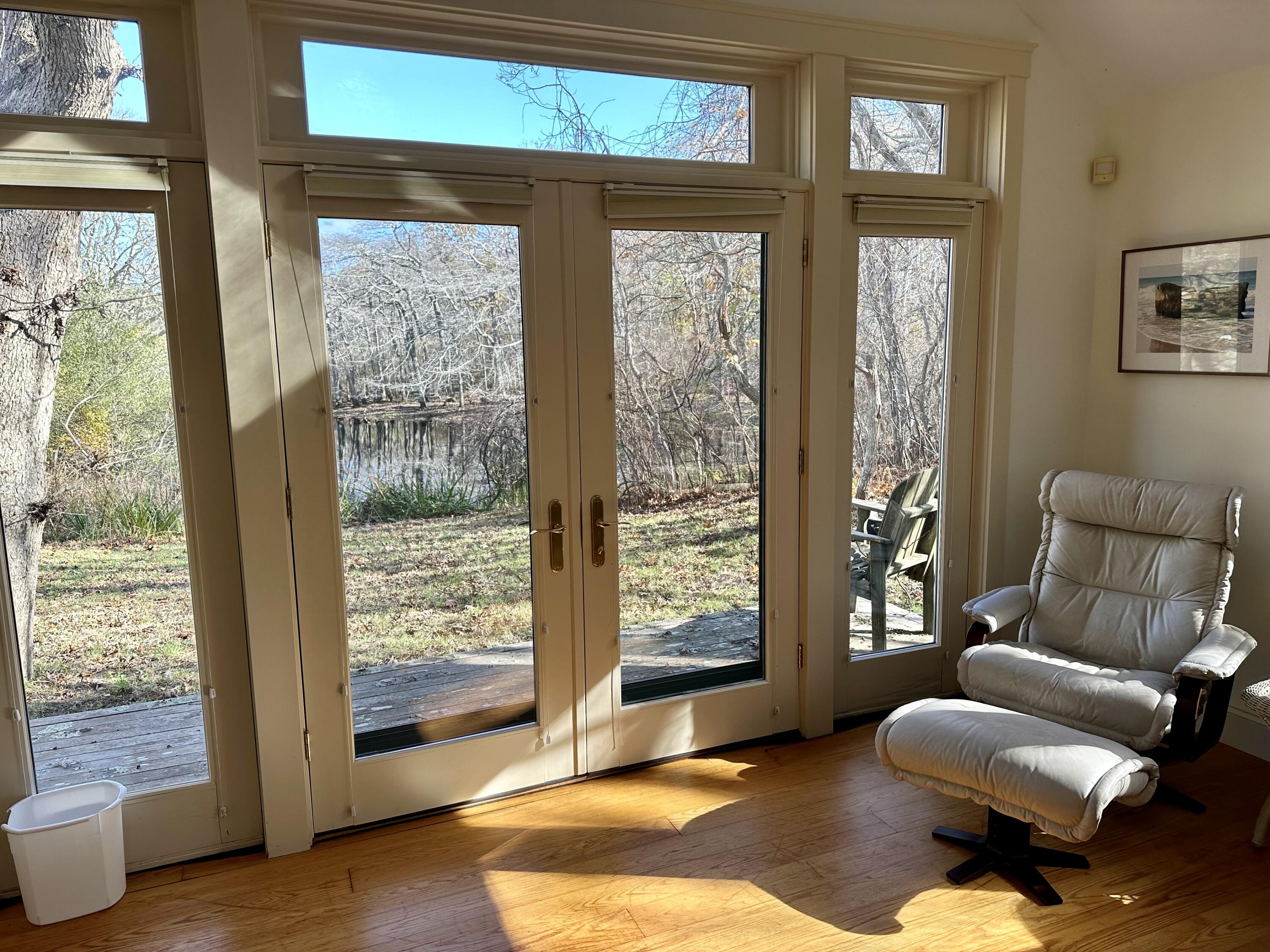 8 Harpoon Hollow Road Aquinnah, MA 02535 - Photo 9 of 29 a living room with furniture and a large window