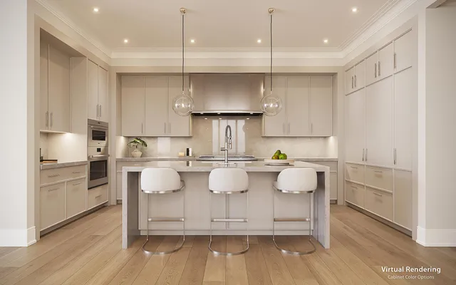 a kitchen with kitchen island white cabinets and stainless steel appliances