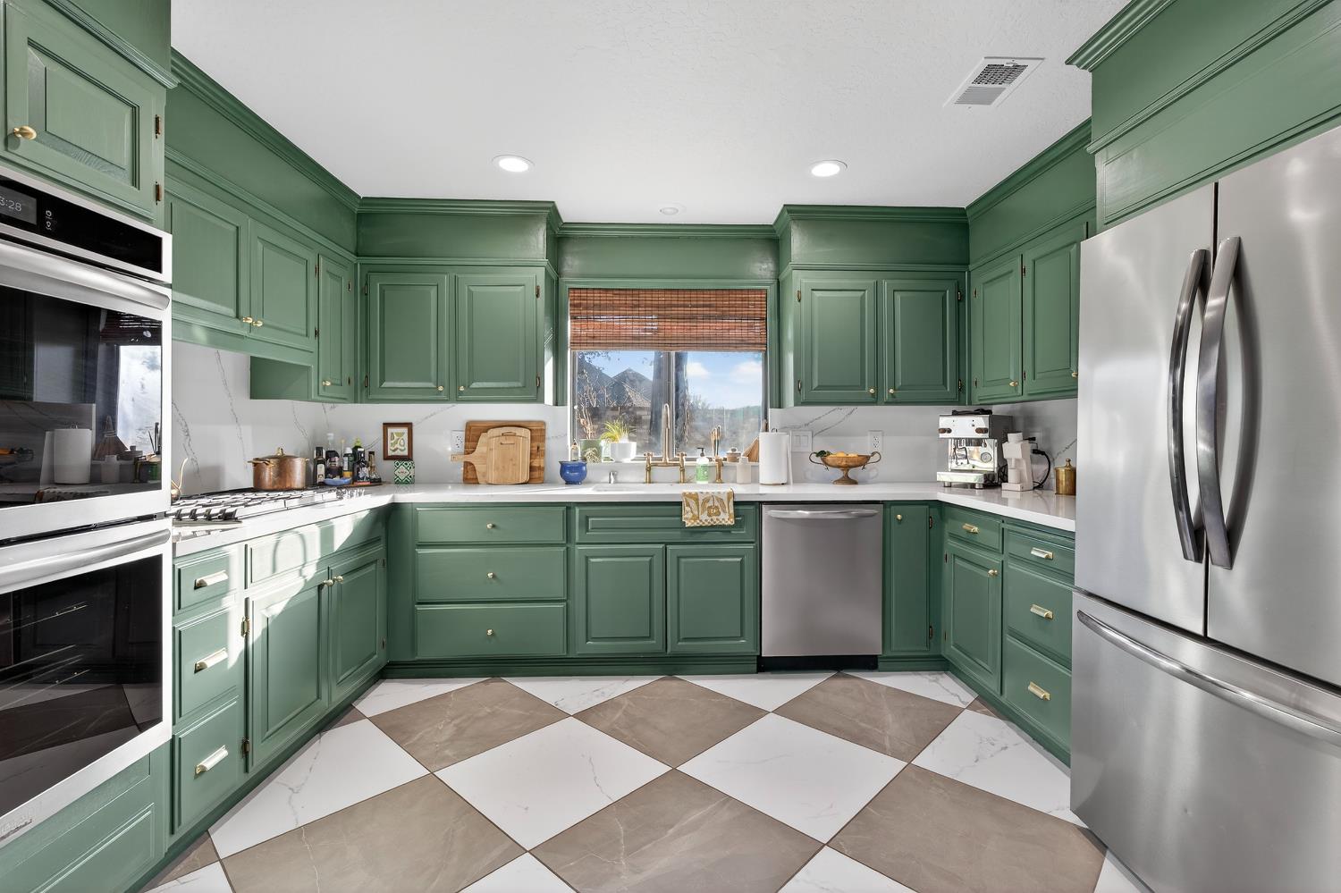 2348 Eilers Lane Lodi, CA 95242 - Photo 16 of 46 a kitchen with a sink cabinets and stainless steel appliances