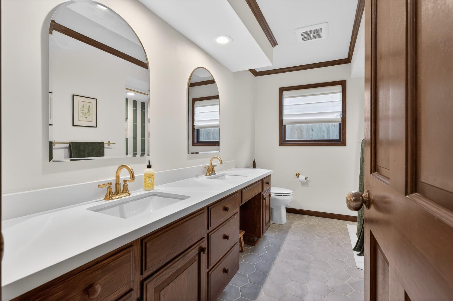 2348 Eilers Lane Lodi, CA 95242 - Photo 24 of 46 a bathroom with double sink and a mirror