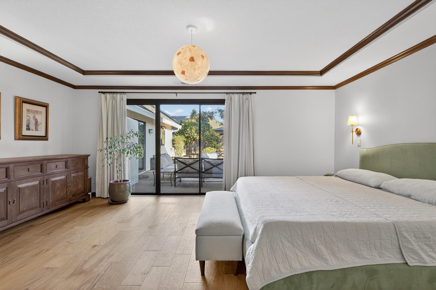 2348 Eilers Lane Lodi, CA 95242 - Photo 33 of 46 a bedroom with a bed and wooden floor