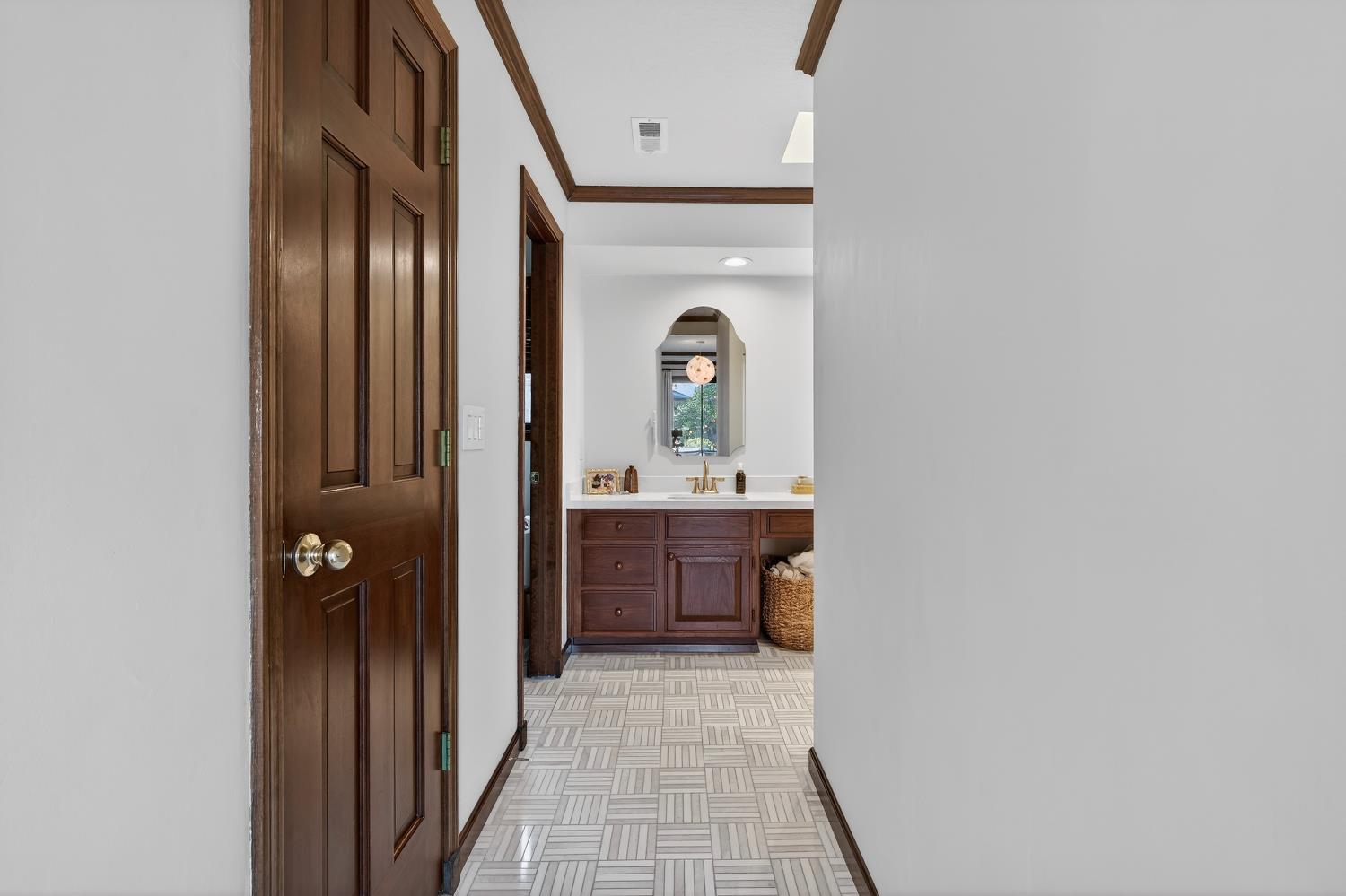 2348 Eilers Lane Lodi, CA 95242 - Photo 35 of 46 a en suite bathroom with a sink a mirror and a vanity