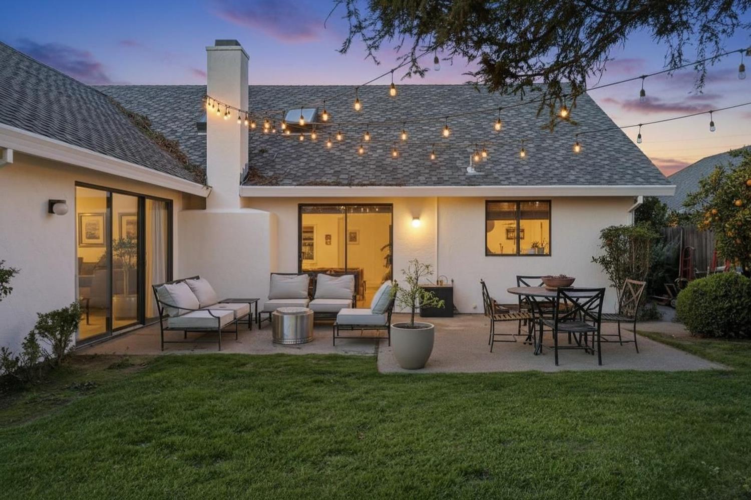 2348 Eilers Lane Lodi, CA 95242 - Photo 40 of 46 a view of a patio with table and chairs potted plants and a large tree