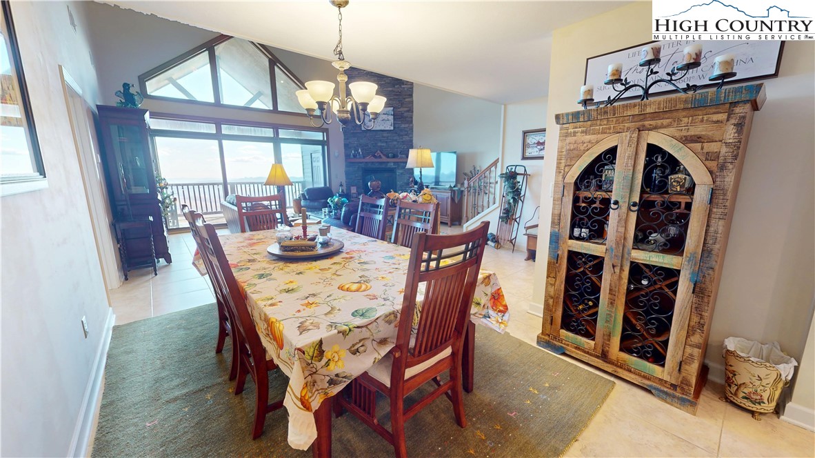 200 Trails End, Unit 36A Sugar Mountain, NC 28604 - Photo 12 of 35 a view of a dining room with furniture window and wooden floor