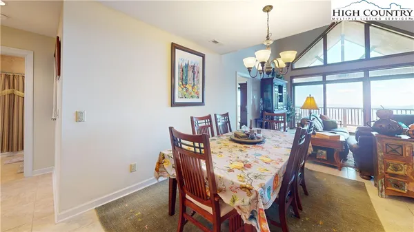 a view of a dining room with furniture and window