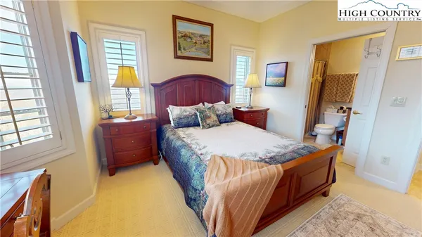 a bedroom with bed and a window