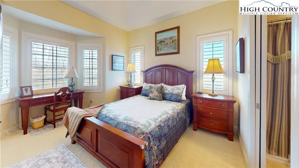 a bed room with a bed and a couch