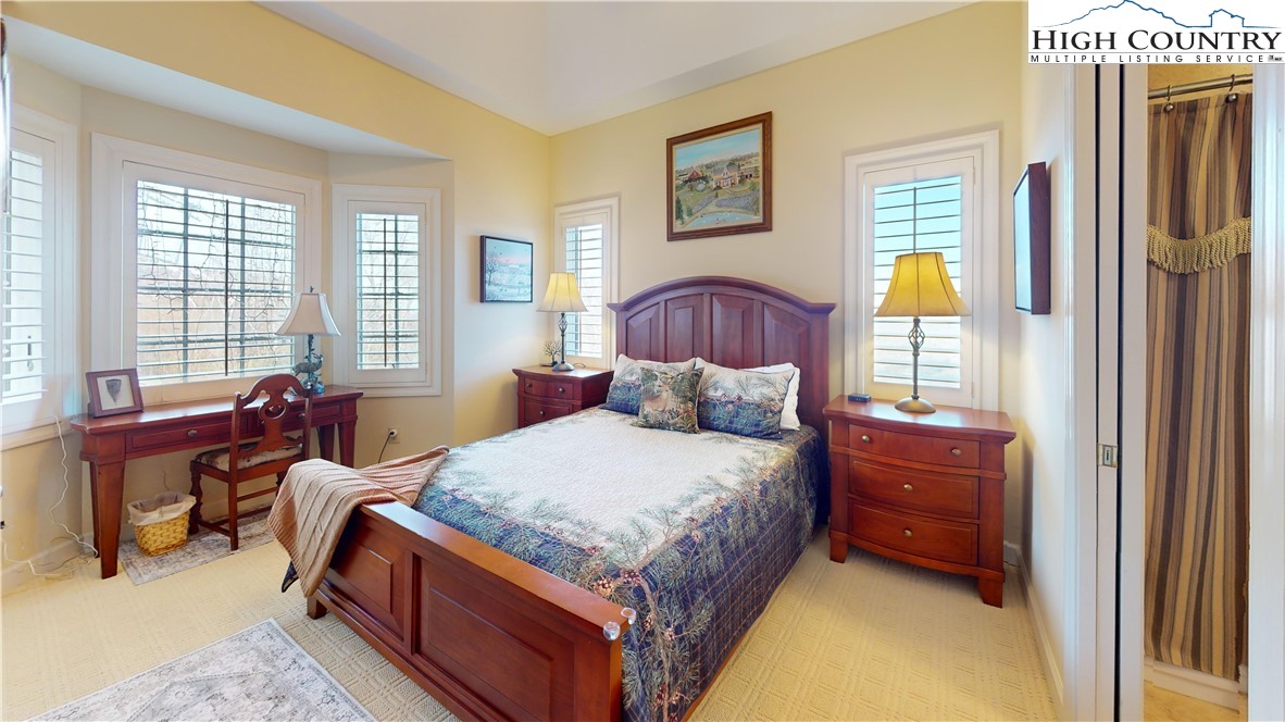 200 Trails End, Unit 36A Sugar Mountain, NC 28604 - Photo 24 of 35 a bed room with a bed and a couch