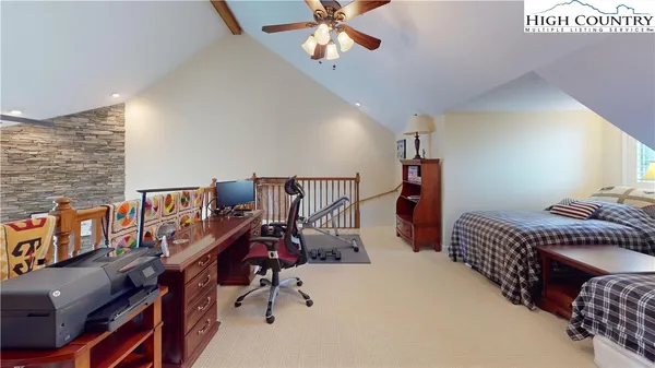 a bedroom with furniture and a chandelier