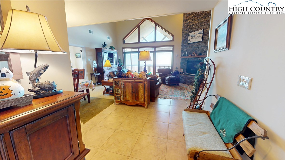 200 Trails End, Unit 36A Sugar Mountain, NC 28604 - Photo 4 of 35 a living room with furniture a window and a flat screen tv