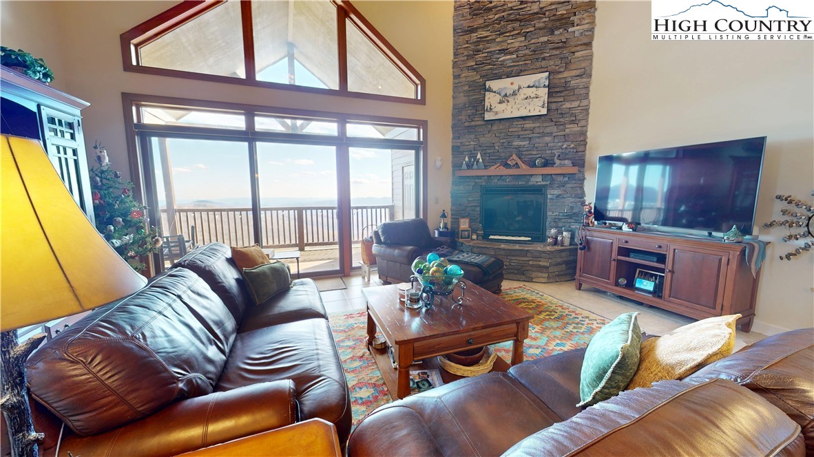 200 Trails End, Unit 36A Sugar Mountain, NC 28604 - Photo 7 of 35 a living room with furniture fireplace and a flat screen tv