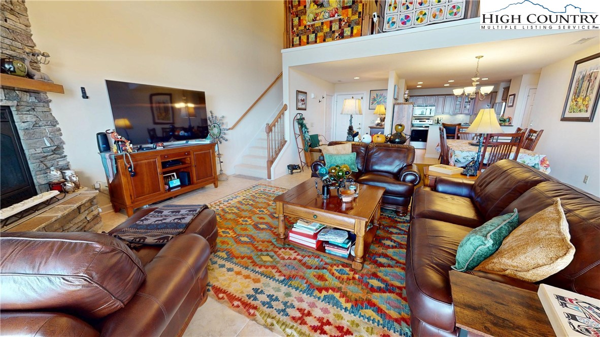 200 Trails End, Unit 36A Sugar Mountain, NC 28604 - Photo 9 of 35 a living room with furniture and a flat screen tv