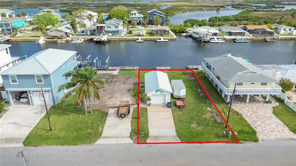 an aerial view of a house with outdoor space