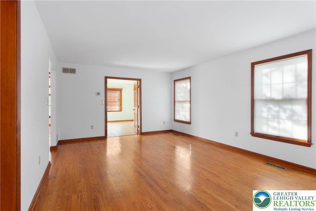 434 Schoeneck Avenue Nazareth, PA 18064 - Photo 14 of 39 an empty room with wooden floor and windows