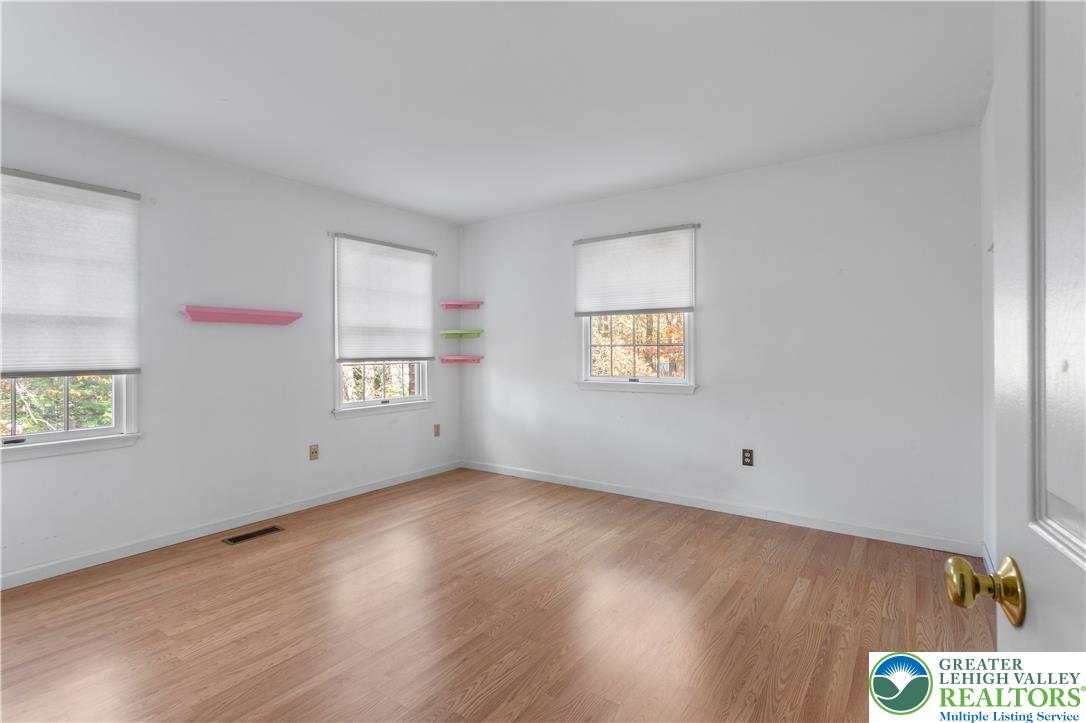 434 Schoeneck Avenue Nazareth, PA 18064 - Photo 17 of 39 a view of an empty room with wooden floor and a window