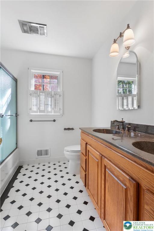 434 Schoeneck Avenue Nazareth, PA 18064 - Photo 21 of 39 a bathroom with a sink a toilet a mirror and shower