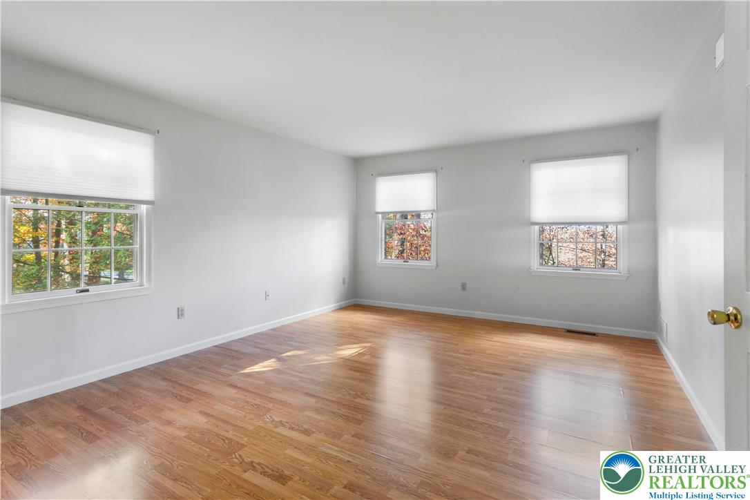 434 Schoeneck Avenue Nazareth, PA 18064 - Photo 22 of 39 an empty room with wooden floor and windows