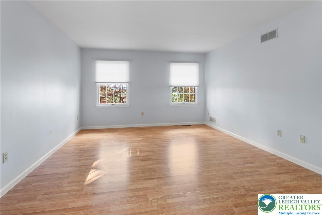 434 Schoeneck Avenue Nazareth, PA 18064 - Photo 23 of 39 an empty room with wooden floor and windows