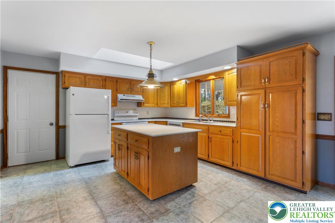 434 Schoeneck Avenue Nazareth, PA 18064 - Photo 4 of 39 a kitchen with stainless steel appliances granite countertop a refrigerator a sink and a stove