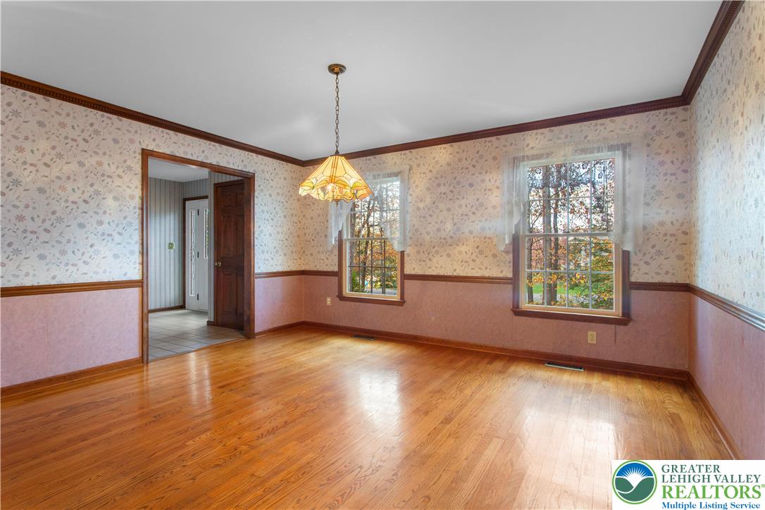 434 Schoeneck Avenue Nazareth, PA 18064 - Photo 8 of 39 a view of an empty room with window and wooden floor