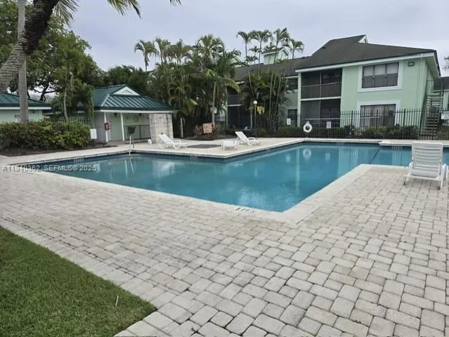 a view of pool with outdoor seating