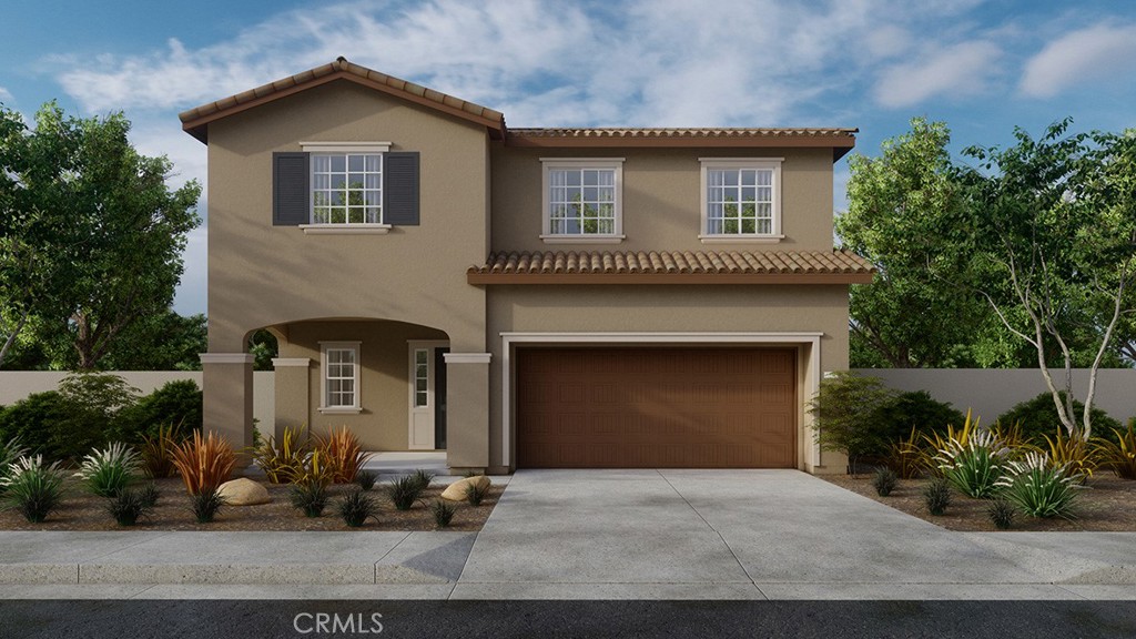 a front view of a house with a yard garage and outdoor seating