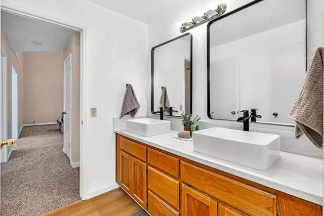 a white toilet sitting next to a bathroom sink