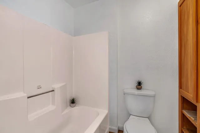 a bathroom with double vanity sinks and a mirror