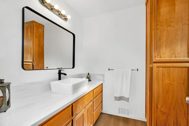 a white bath tub sitting next to a white sink