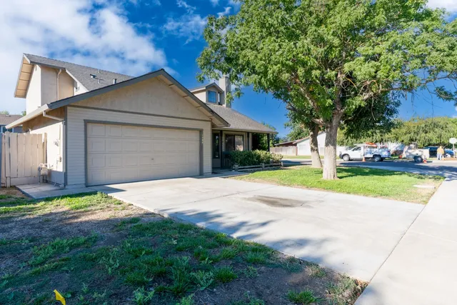 a house with garden in front of it