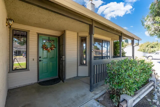 front view of a house with a potted plant