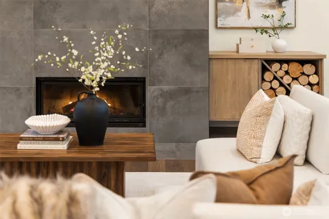 a living room with furniture and a chandelier