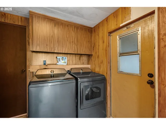 a kitchen with a sink a stove and refrigerator