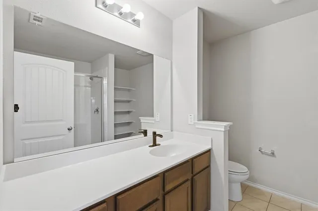 a bathroom with a glass shower door